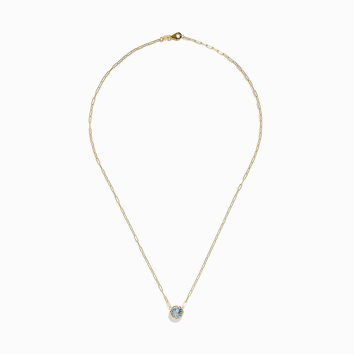 The 14K Yellow Gold Aquamarine Bezel Paperclip Chain Pendant features a round light blue aquamarine in a simple gold bezel on a delicate paperclip chain, shown against a white background.