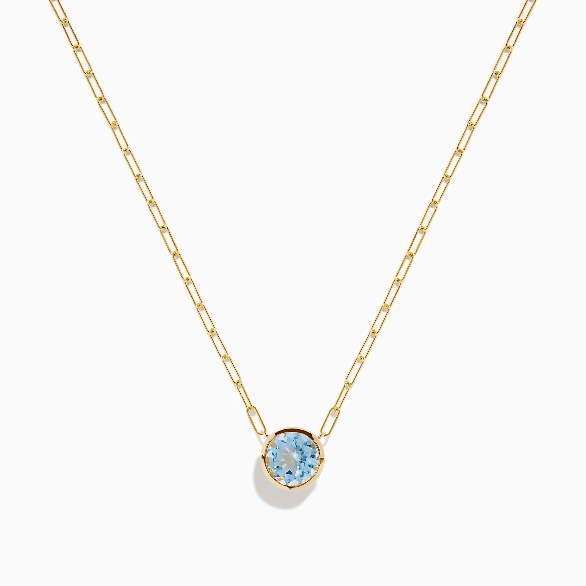 The 14K Yellow Gold Aquamarine Bezel Paperclip Chain Pendant features a round light blue aquamarine in a simple gold bezel on a delicate paperclip chain, shown against a white background.
