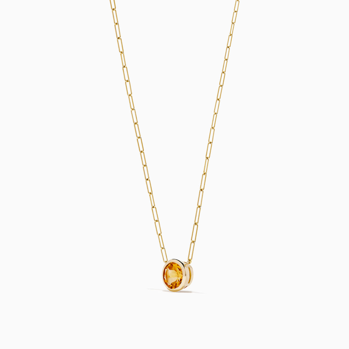 The 14K Yellow Gold Citrine Bezel Paperclip Chain Pendant features a single round citrine gemstone set in yellow gold, displayed on a white background.