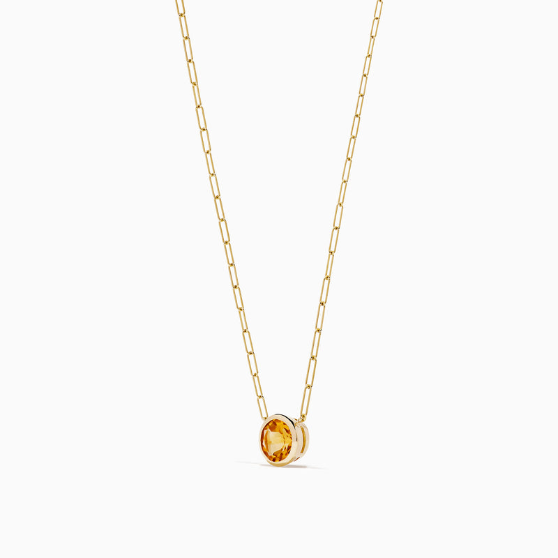 The 14K Yellow Gold Citrine Bezel Paperclip Chain Pendant features a single round citrine gemstone set in yellow gold, displayed on a white background.