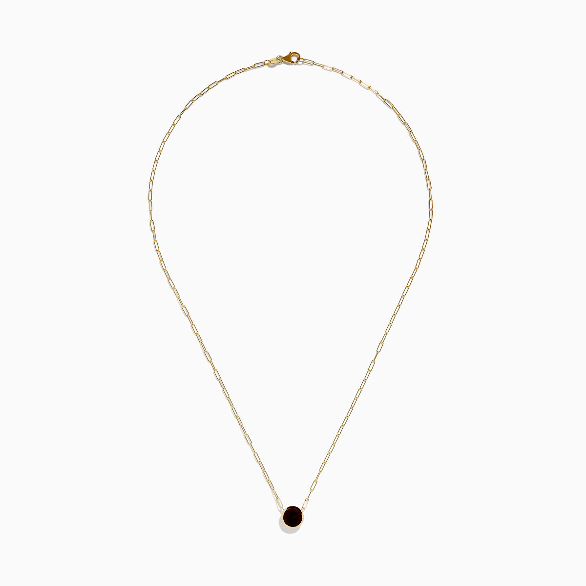 The 14K Yellow Gold Garnet Bezel Pendant with Paperclip Chain features a round dark red garnet in a simple gold bezel, showcased against a white background.