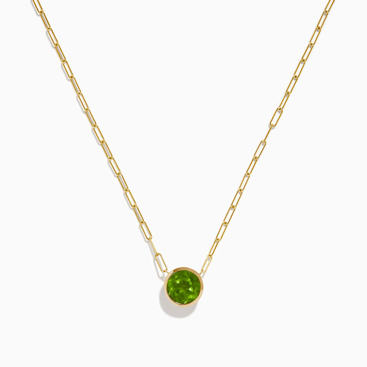 The 14K Yellow Gold Peridot Bezel Pendant with Paperclip Chain features elongated links and a round, faceted peridot set in a simple bezel setting.
