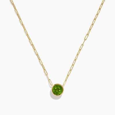The 14K Yellow Gold Peridot Bezel Pendant with Paperclip Chain features elongated links and a round, faceted peridot set in a simple bezel setting.