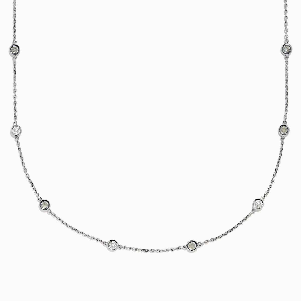 The 14K White Gold 36 Inch 3.00ct Diamond Station Necklace features a white gold chain with evenly spaced round bezel-set diamonds for a timeless, elegant look.