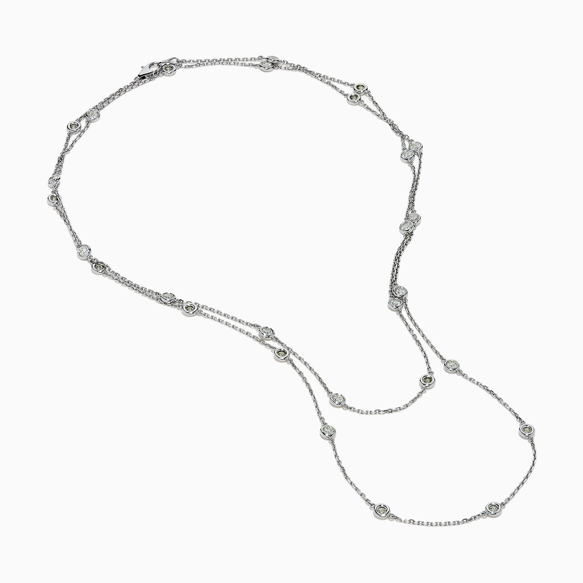 The 14K White Gold 36 Inch 3.00ct Diamond Station Necklace features a white gold chain with evenly spaced round bezel-set diamonds for a timeless, elegant look.