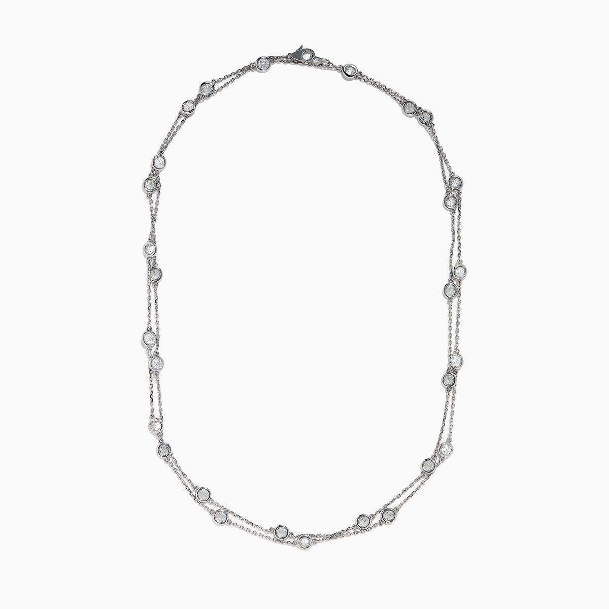 The 14K White Gold 36 Inch 6.00ct Diamond Station Necklace features evenly spaced round bezel-set diamonds along a fine chain, elegantly displayed on a white background.