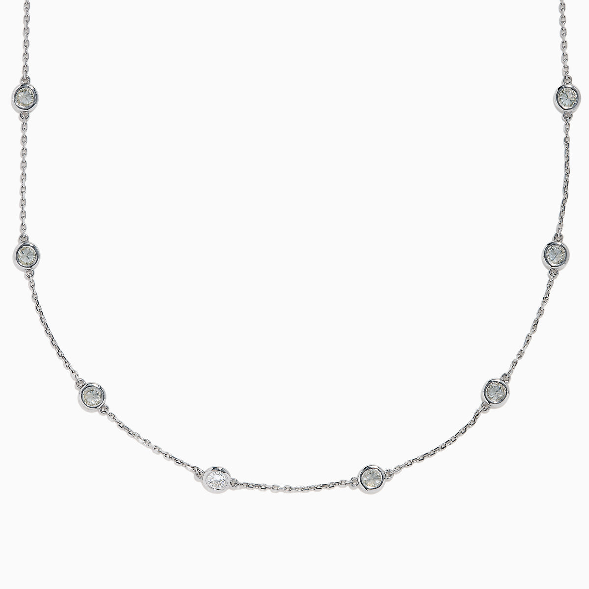 The 14K White Gold 36 Inch 6.00ct Diamond Station Necklace features evenly spaced round bezel-set diamonds along a fine chain, elegantly displayed on a white background.