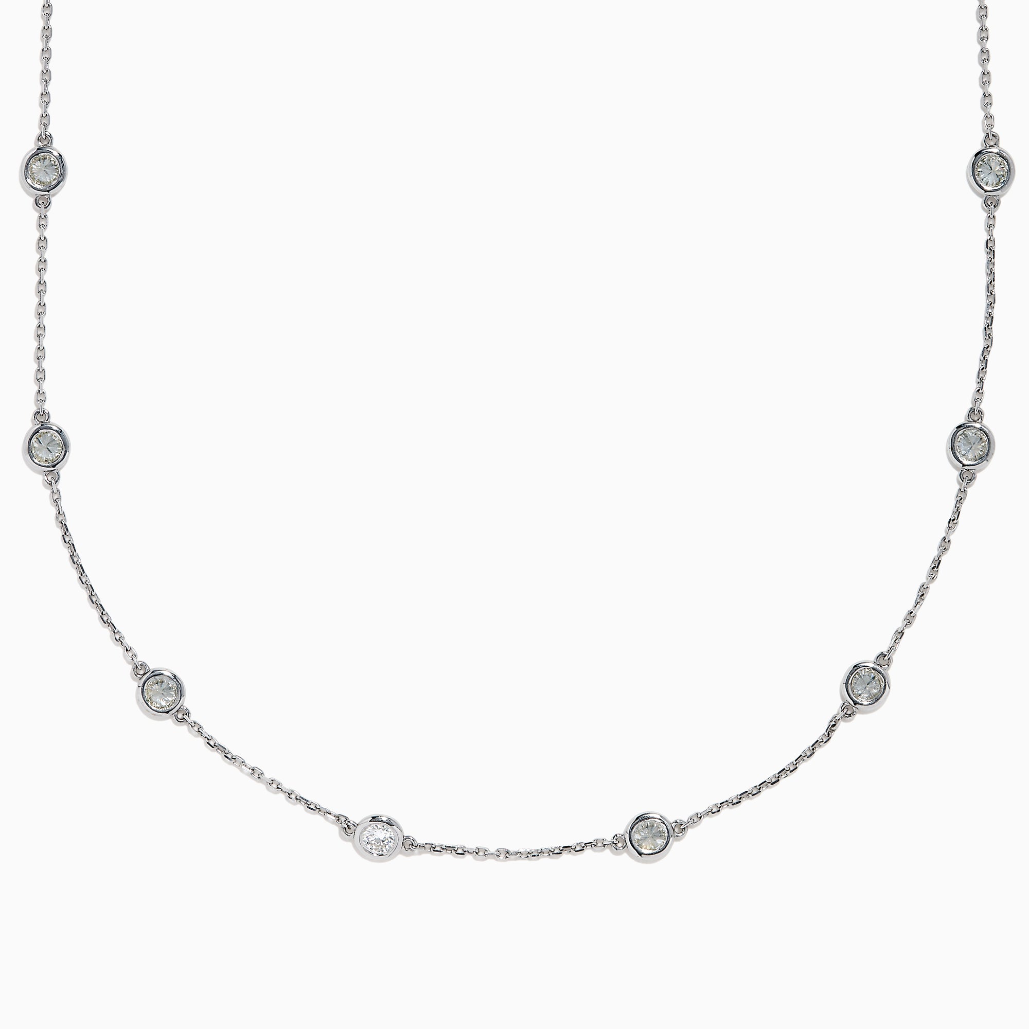 The 14K White Gold 36 Inch 6.00ct Diamond Station Necklace features evenly spaced round bezel-set diamonds along a fine chain, elegantly displayed on a white background.