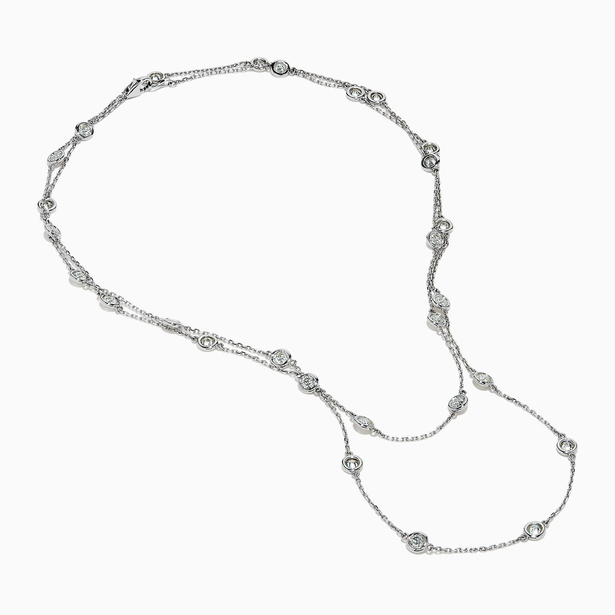 The 14K White Gold 36 Inch 6.00ct Diamond Station Necklace features evenly spaced round bezel-set diamonds along a fine chain, elegantly displayed on a white background.