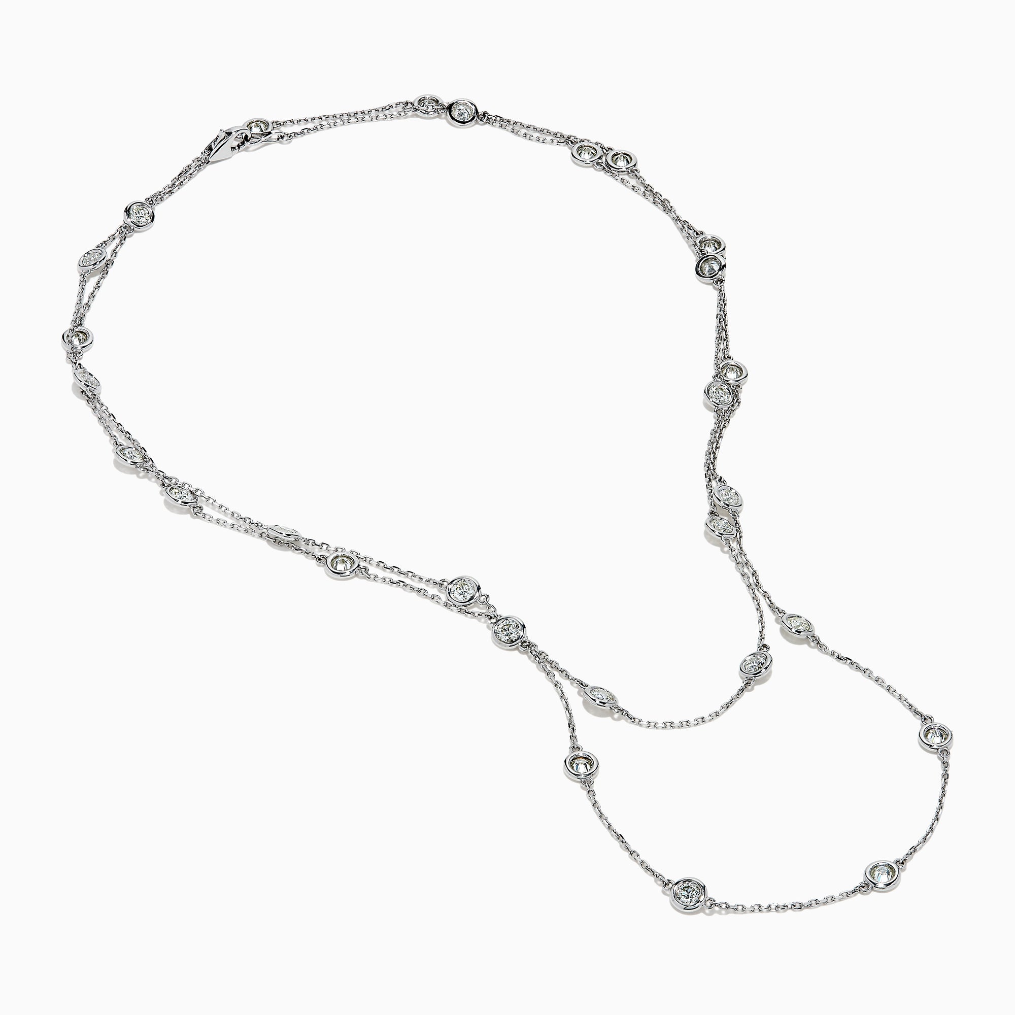 The 14K White Gold 36 Inch 6.00ct Diamond Station Necklace features evenly spaced round bezel-set diamonds along a fine chain, elegantly displayed on a white background.