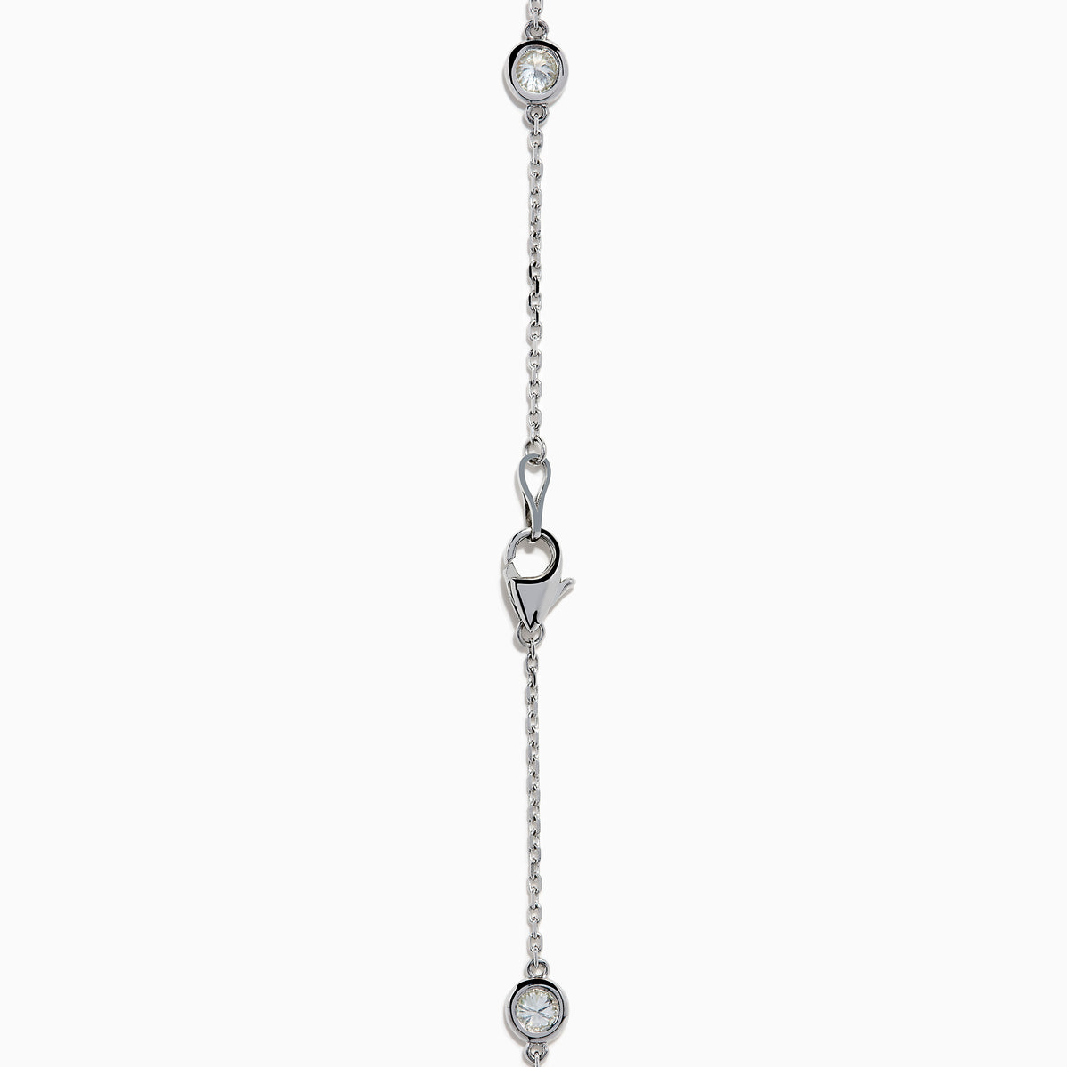 The 14K White Gold 36 Inch 6.00ct Diamond Station Necklace features evenly spaced round bezel-set diamonds along a fine chain, elegantly displayed on a white background.