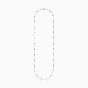 The 14K White Gold 36 Inch 6.00ct Diamond Station Necklace features evenly spaced round bezel-set diamonds along a fine chain, elegantly displayed on a white background.