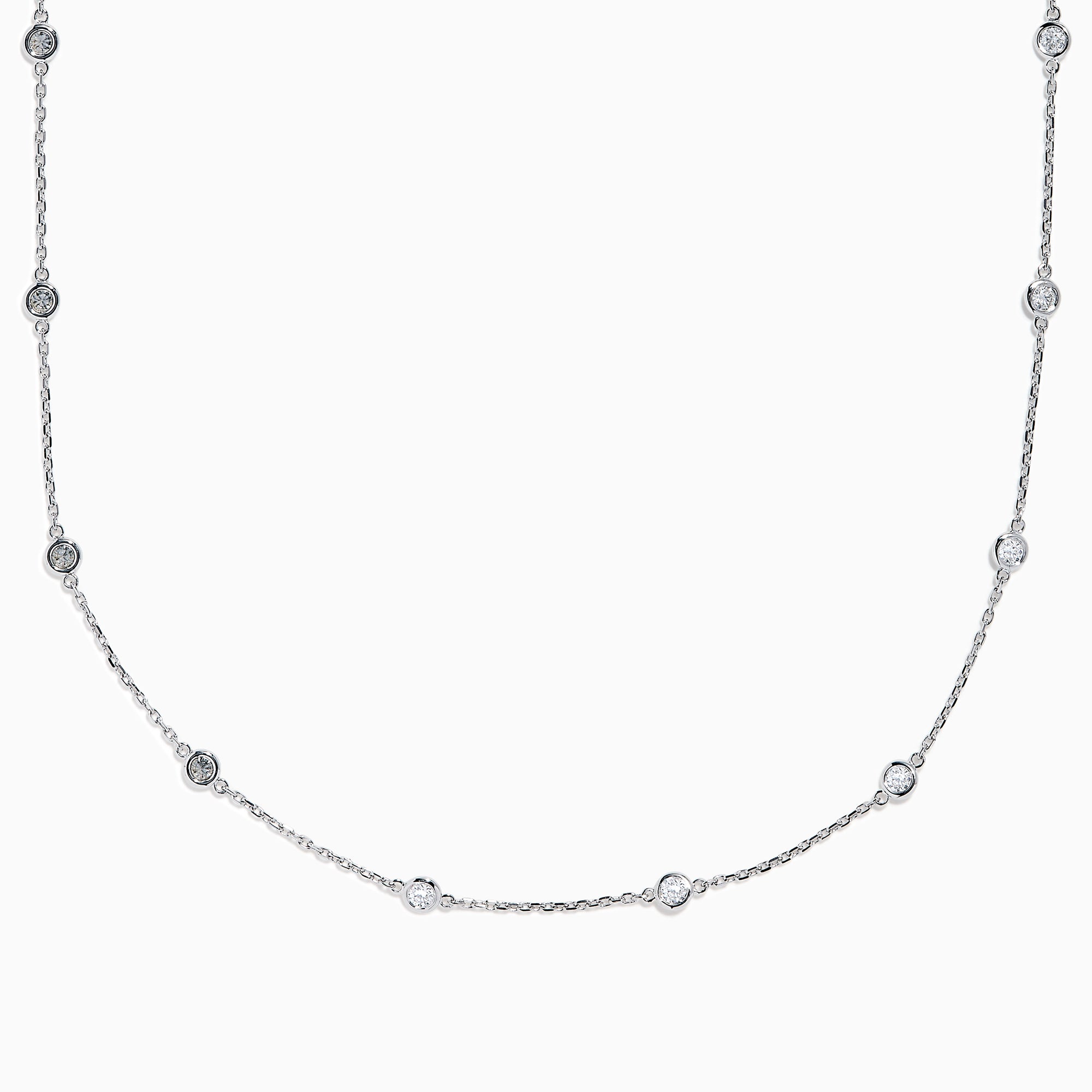 The 14K White Gold Diamond Station Necklace, 1.00 TCW, features evenly spaced round diamonds along a fine chain and is secured with a lobster clasp.