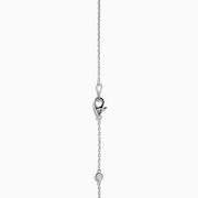 The 14K White Gold Diamond Station Necklace, 1.00 TCW, features evenly spaced round diamonds along a fine chain and is secured with a lobster clasp.