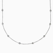 The 14K White Gold 36 Inch 2.00ct Diamond Station Necklace showcases round bezel-set diamonds evenly spaced along a fine chain, presented on a plain white background.