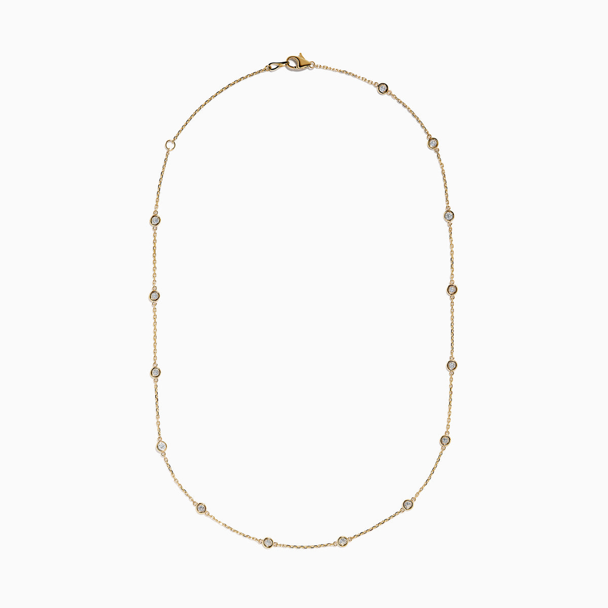 The 14K Yellow Gold Diamond Station Necklace, 1.00 TCW, features evenly spaced round diamonds in bezel settings on a delicate gold chain, shown elegantly against a white background.