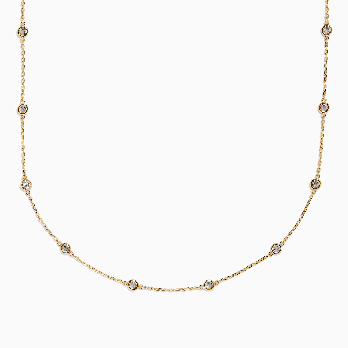 The 14K Yellow Gold Diamond Station Necklace, 1.00 TCW, features evenly spaced round diamonds in bezel settings on a delicate gold chain, shown elegantly against a white background.