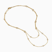 The 14K Yellow Gold 36 Inch 2.00ct Diamond Station Necklace features bezel-set round diamonds spaced evenly along a delicate gold chain, shown against a white background.