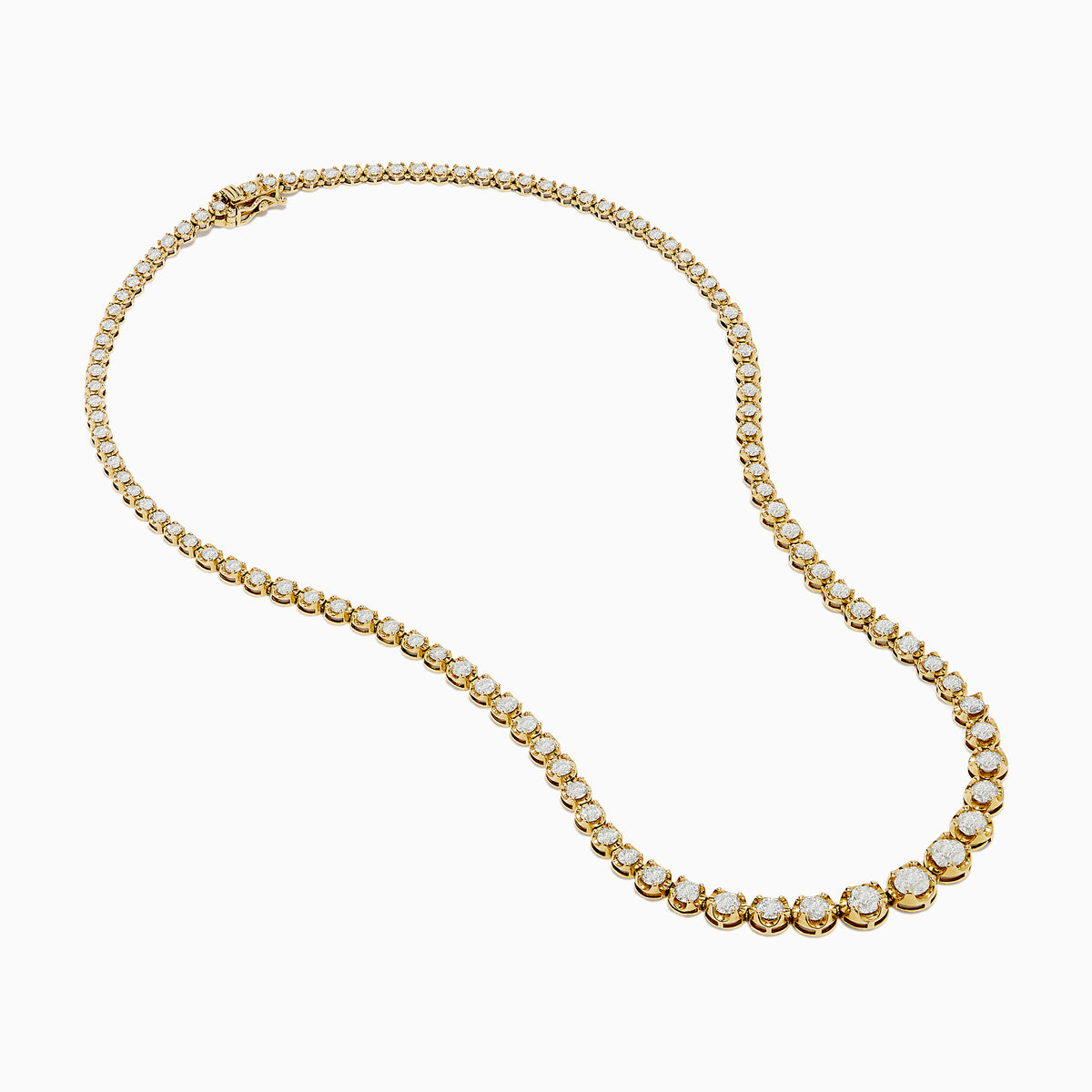 The 14K Yellow Gold Miracle Set Diamond Graduated Tennis Necklace showcases a single row of closely set, sparkling round diamonds in a gentle curve on yellow gold.