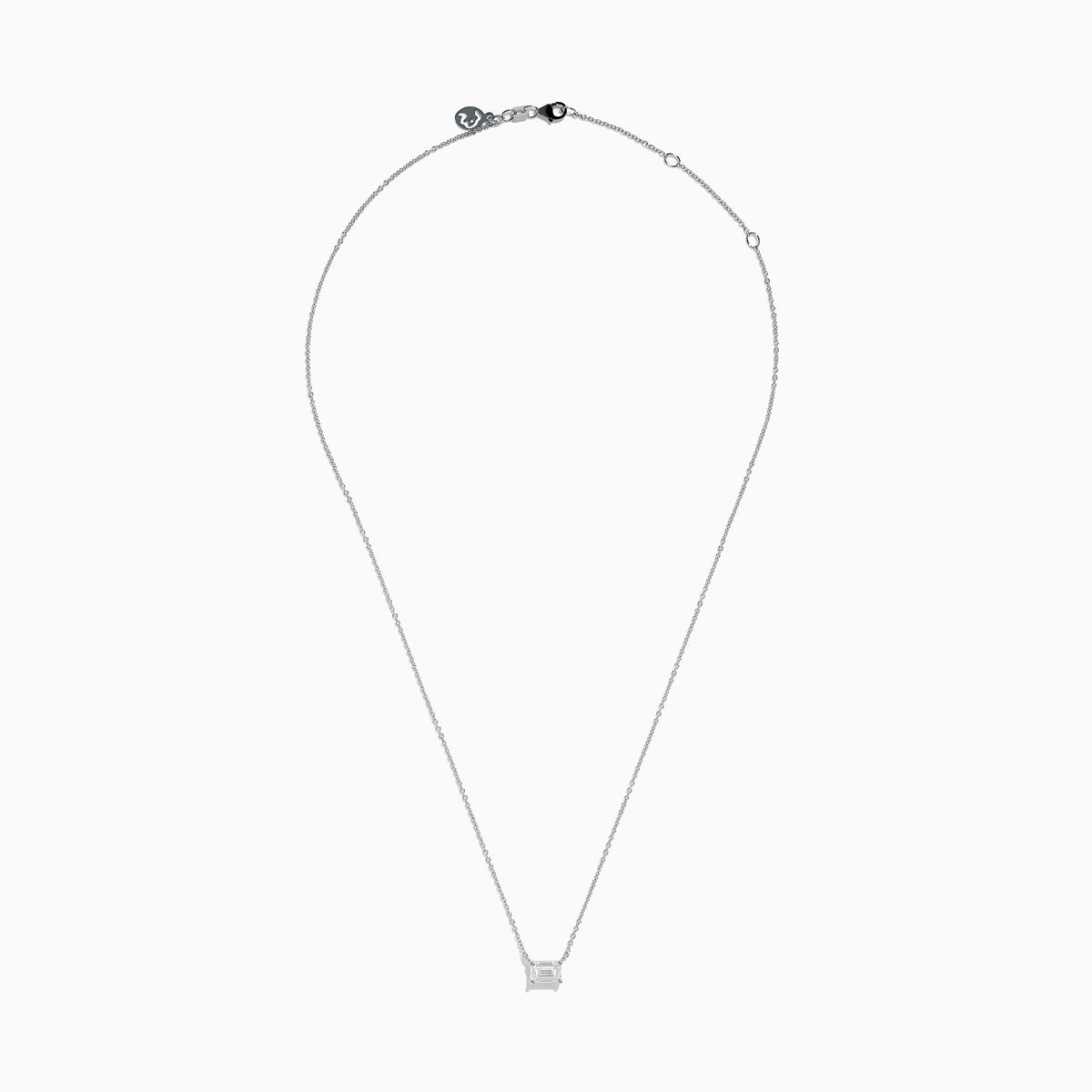 The Lab Grown Diamond Emerald Cut 1.00ct Solitaire Necklace in 14K White Gold features a sparkling emerald-cut diamond pendant, elegantly centered on a delicate white gold chain and displayed against a plain white background.
