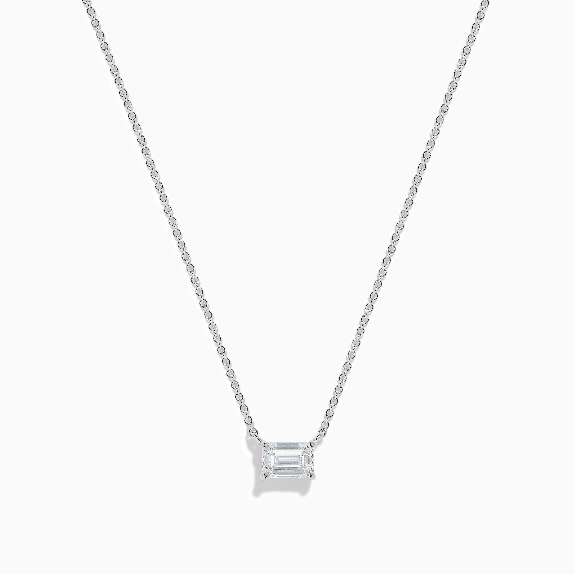 The Lab Grown Diamond Emerald Cut 1.00ct Solitaire Necklace in 14K White Gold features a sparkling emerald-cut diamond pendant, elegantly centered on a delicate white gold chain and displayed against a plain white background.