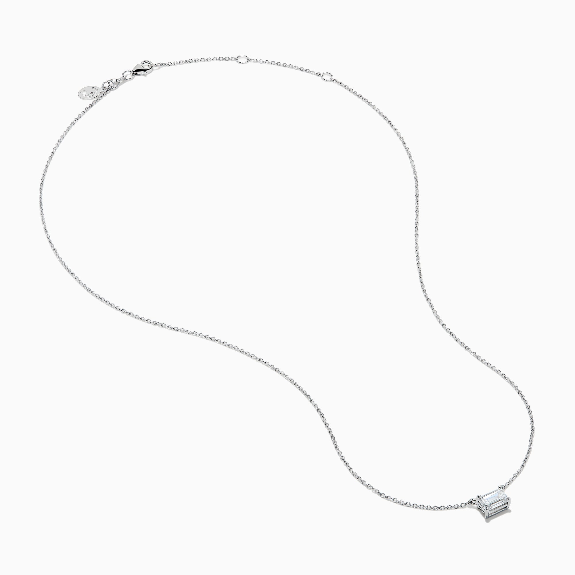 The Lab Grown Diamond Emerald Cut 1.00ct Solitaire Necklace in 14K White Gold features a sparkling emerald-cut diamond pendant, elegantly centered on a delicate white gold chain and displayed against a plain white background.