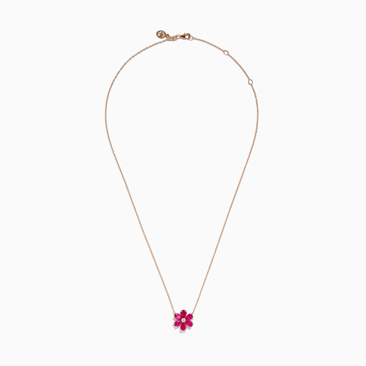 The 14K Rose Gold Ruby Flower Necklace features a pendant with six ruby gemstone petals and a small clear central stone.