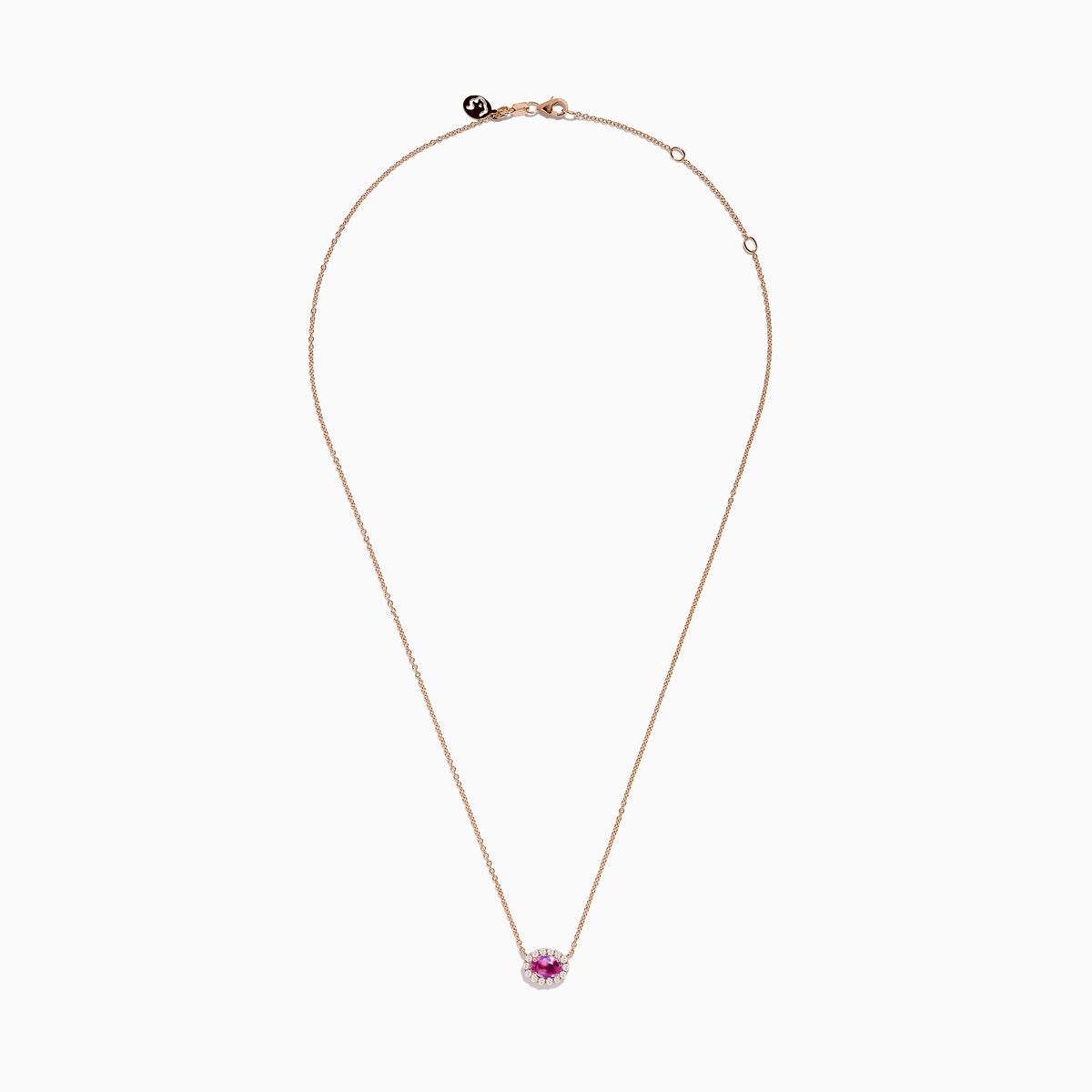 The 14K Rose Gold Pink Sapphire and Diamond Necklace features an oval pink sapphire pendant surrounded by a halo of white diamonds, elegantly displayed against a white background.