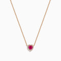 The Novelty 14K Rose Gold Pink Sapphire and Diamond Heart Necklace features a rose gold chain with a heart-shaped pendant showcasing a central pink sapphire surrounded by sparkling diamonds.