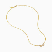 The 14K Yellow Gold Pavé Diamond Infinity Necklace features a horizontal infinity symbol pendant adorned with tiny clear pavé diamonds.