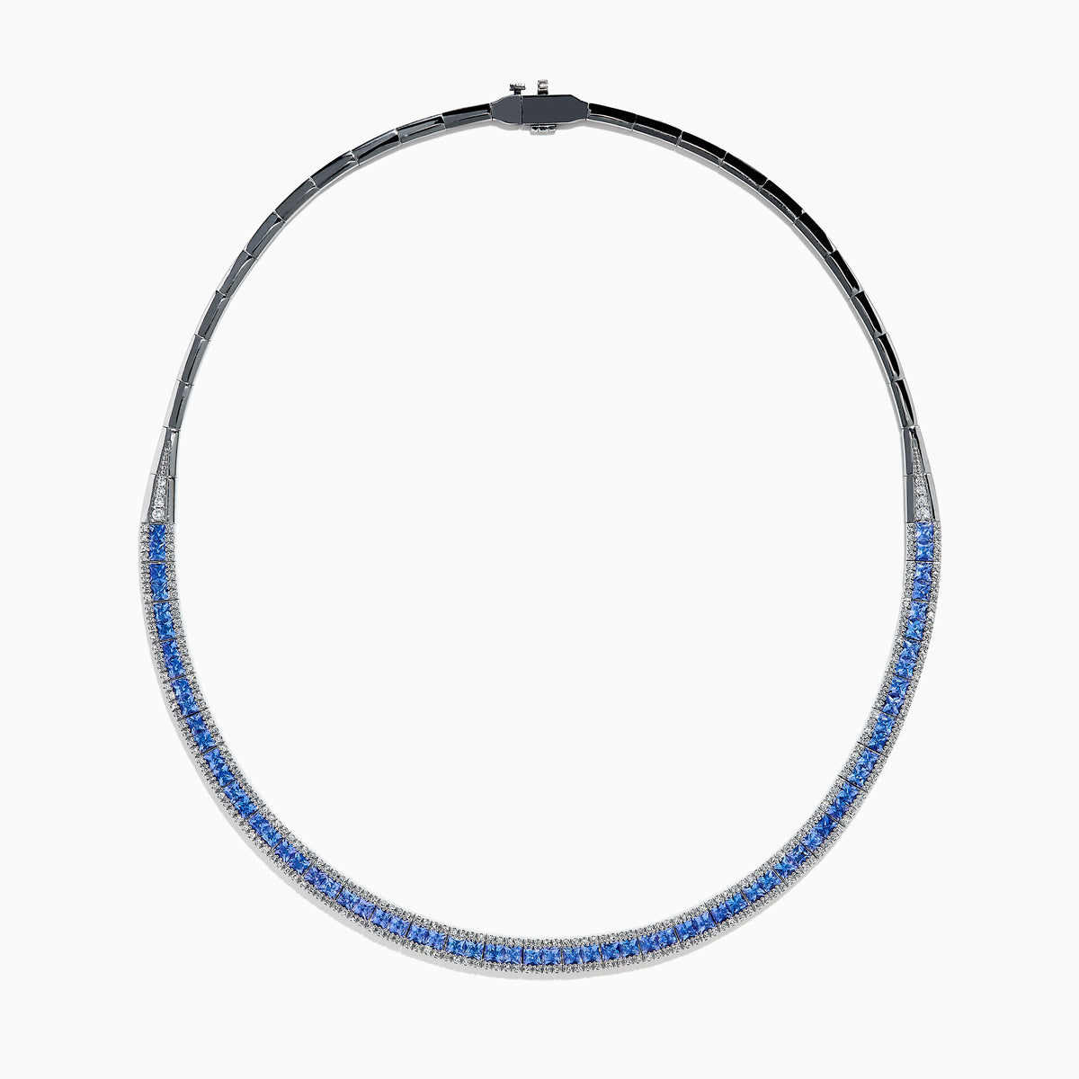The 14K White Gold Tanzanite and Diamond Collar Necklace showcases a row of vivid blue tanzanites edged with sparkling diamonds on a sleek curved band, elegantly displayed against a white background.