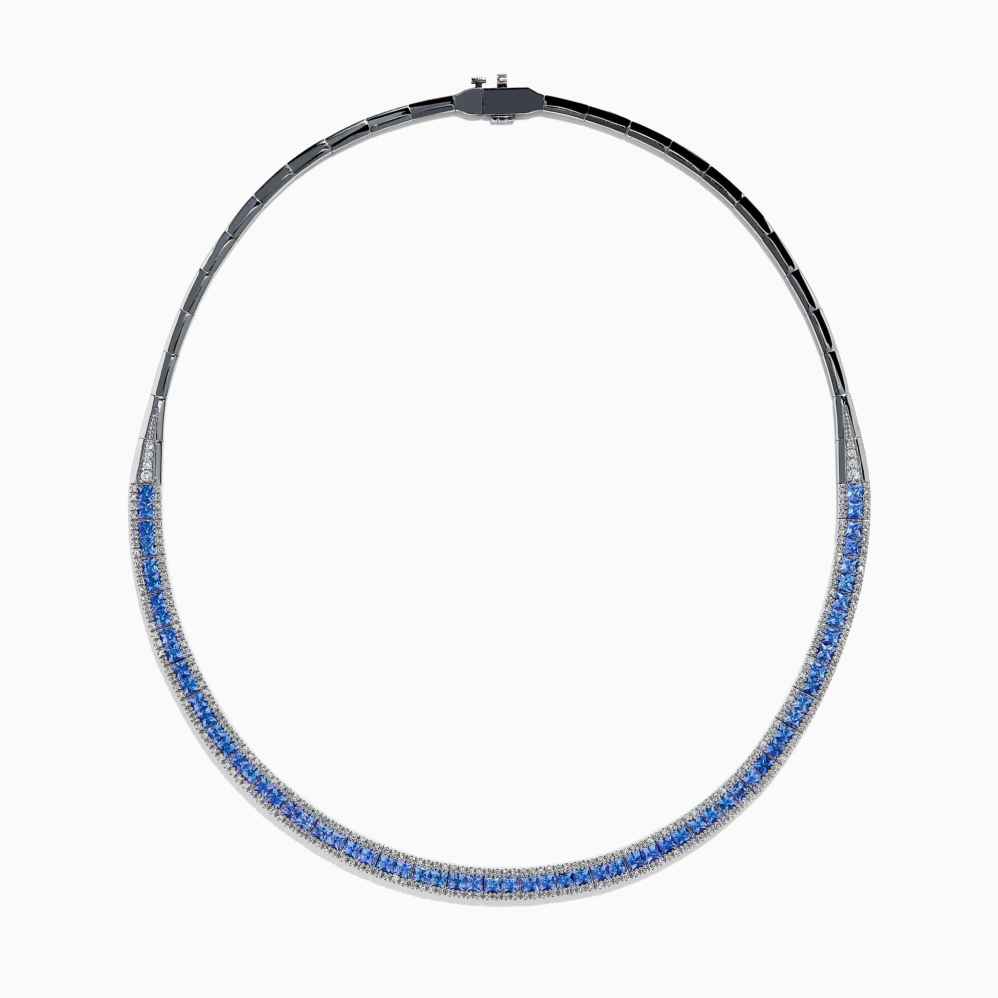The 14K White Gold Tanzanite and Diamond Collar Necklace showcases a row of vivid blue tanzanites edged with sparkling diamonds on a sleek curved band, elegantly displayed against a white background.