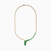 The Brasilica 14K Yellow Gold Emerald and Diamond Statement Necklace features an elegant leaf-shaped emerald on one side and sparkling diamonds on the other, meeting in a radiant V-shape at the center.