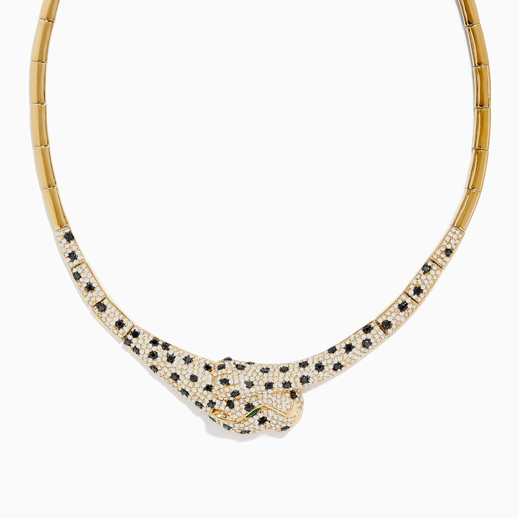 The Signature 14K Yellow Gold Emerald, Black and White Diamond Necklace features a panther-inspired design with a gold body encrusted in black and white diamonds for a stunning spotted pattern, accented by vivid emerald eyes.