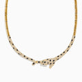The Signature 14K Yellow Gold Diamond and Emerald Panther Necklace features a panther centerpiece adorned with black and white gemstones, sparkling diamonds, and vivid emeralds on its outstretched body.