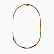The Watercolors 14K Yellow Gold Multi Color Sapphire Tennis Necklace showcases a rainbow gradient of rectangular sapphires—blue, green, yellow, orange, and pink—set in yellow gold against a white background.