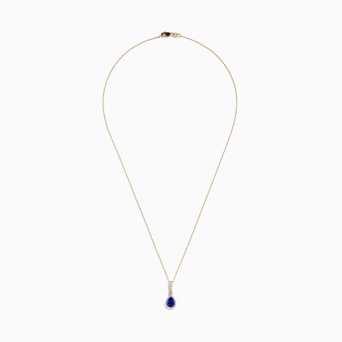 The Nahla 14K Yellow Gold Tanzanite Pendant features a teardrop blue tanzanite surrounded by diamonds and a diamond-accented bail, gleaming at the center of this elegant necklace.