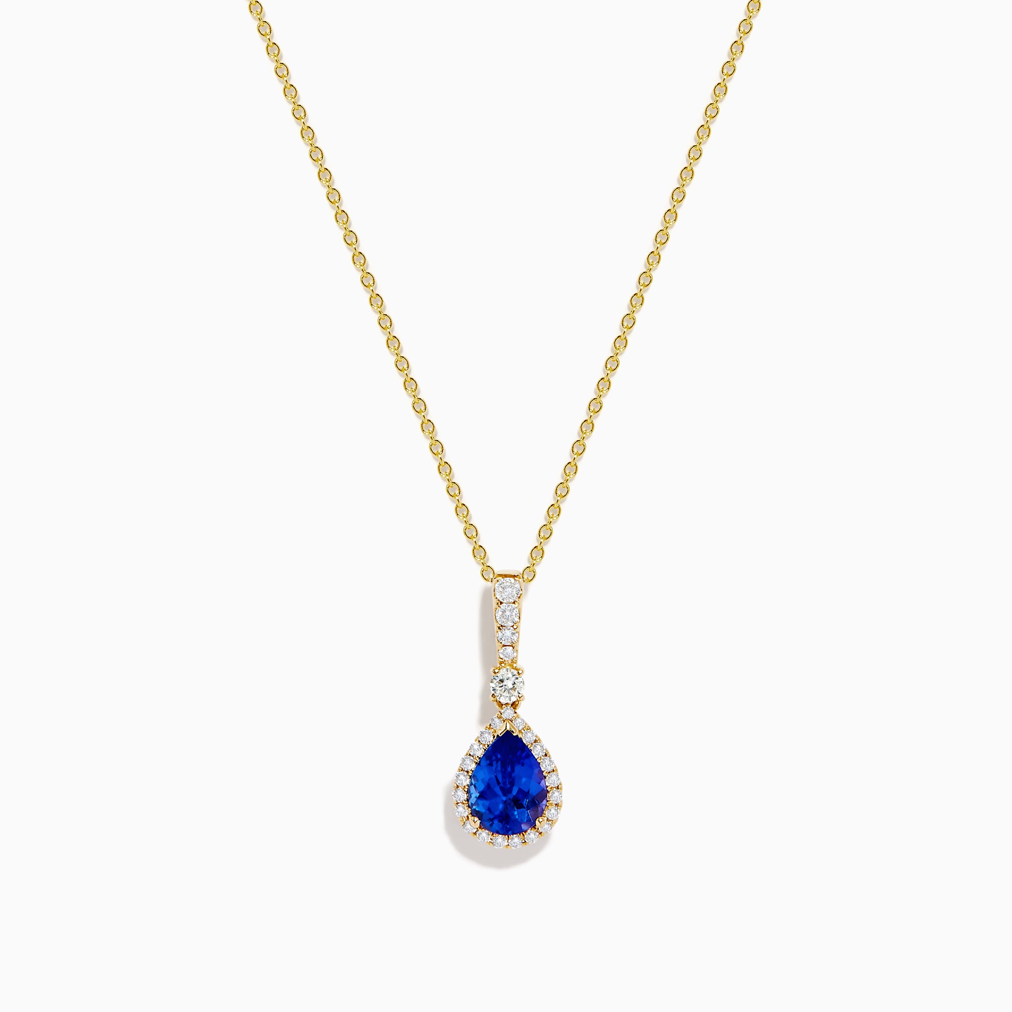 The Nahla 14K Yellow Gold Tanzanite Pendant features a teardrop blue tanzanite surrounded by diamonds and a diamond-accented bail, gleaming at the center of this elegant necklace.