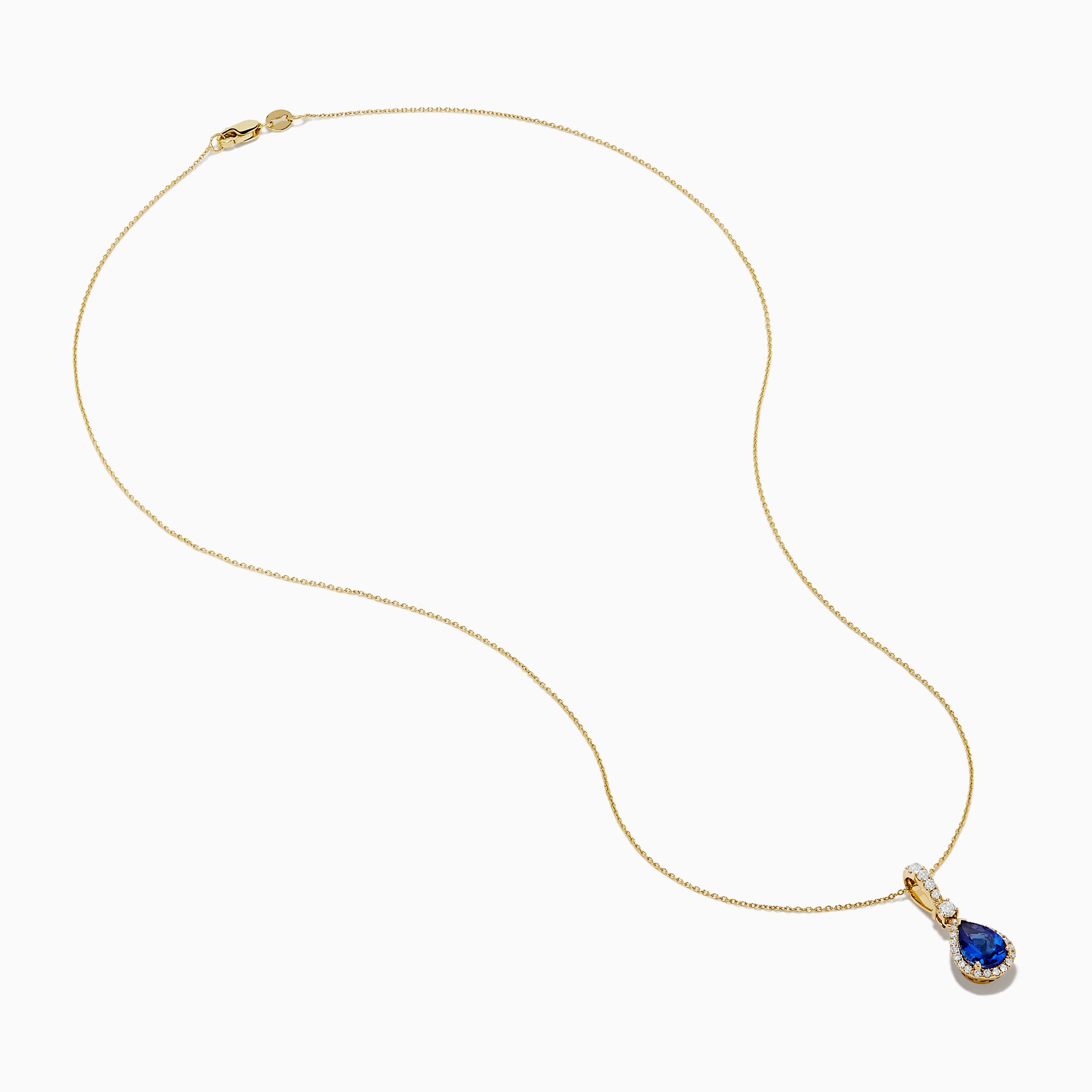 The Nahla 14K Yellow Gold Tanzanite Pendant features a teardrop blue tanzanite surrounded by diamonds and a diamond-accented bail, gleaming at the center of this elegant necklace.