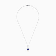 The Nahla 14K White Gold Tanzanite Pendant features a teardrop-shaped blue tanzanite accented by small white stones, set in 14K white gold and suspended from a delicate chain.