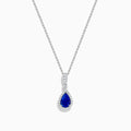 The Nahla 14K White Gold Tanzanite Pendant features a teardrop-shaped blue tanzanite accented by small white stones, set in 14K white gold and suspended from a delicate chain.