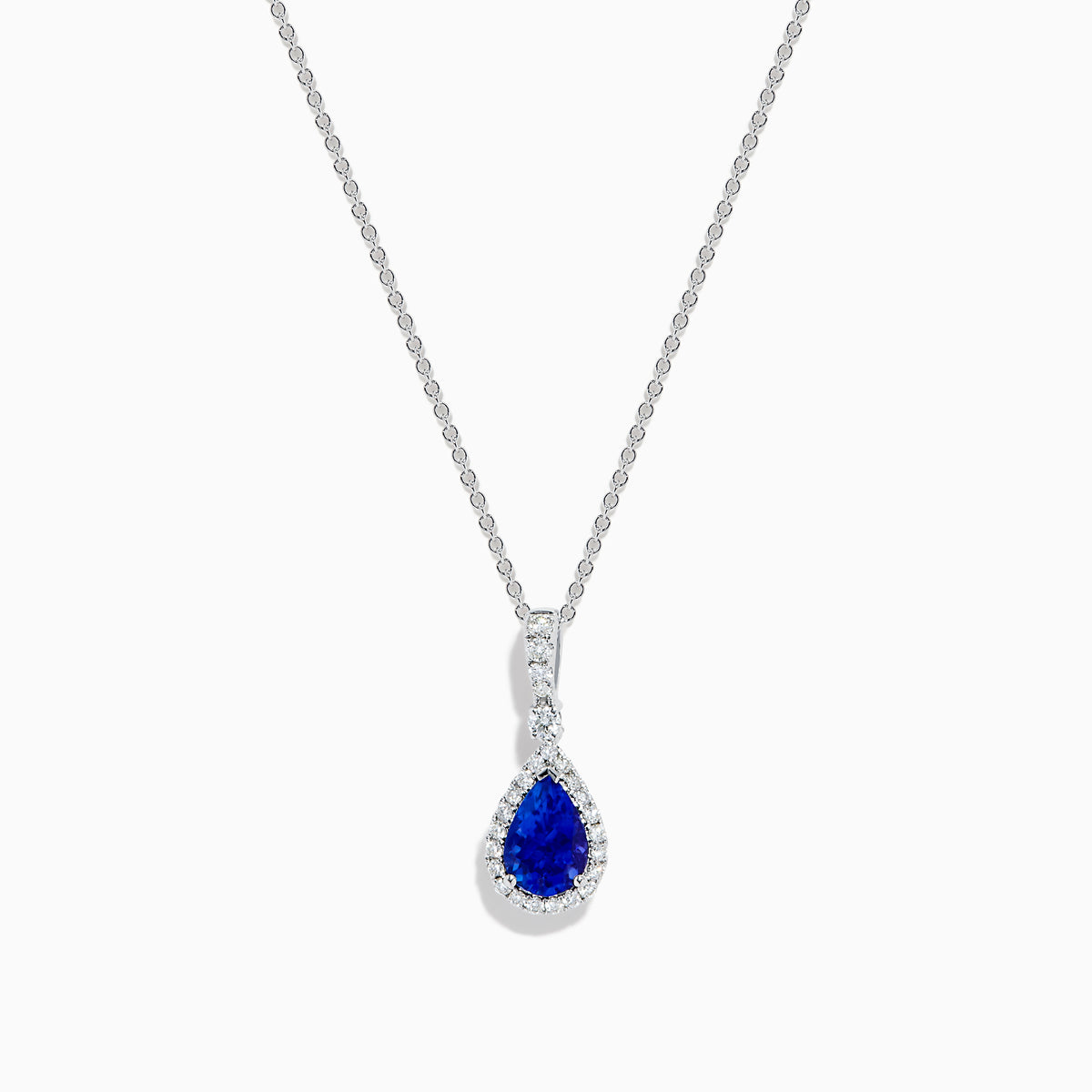 The Nahla 14K White Gold Tanzanite Pendant features a teardrop-shaped blue tanzanite accented by small white stones, set in 14K white gold and suspended from a delicate chain.
