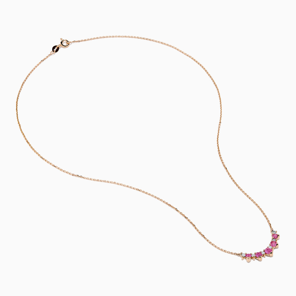 The 14K Rose Gold Pink Sapphire and Diamond Necklace features seven heart-shaped pink sapphires and six small round diamonds set in an alternating pattern along a delicate rose gold chain.