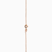 The 14K Rose Gold Pink Sapphire and Diamond Necklace features seven heart-shaped pink sapphires and six small round diamonds set in an alternating pattern along a delicate rose gold chain.