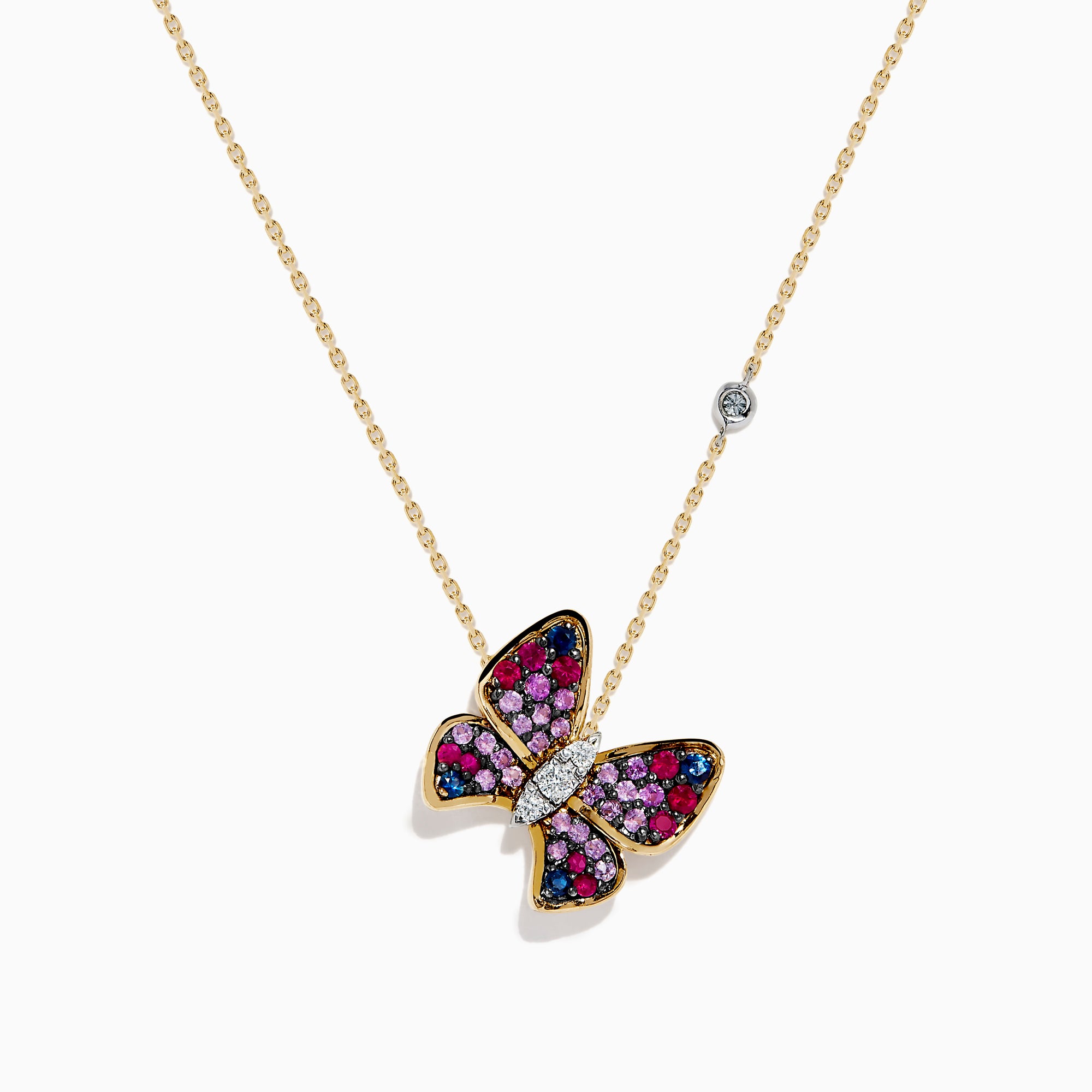The 14 Karat Three Tone Gold Semi Precious and Diamond Butterfly Pendant Necklace showcases a butterfly pendant with pink, red, blue, and clear stones, plus a round gemstone accent on the chain. The butterfly is tilted for added elegance.