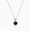 The 14 Karat Yellow Gold Rhodolite Garnet and Diamond Heart Pendant features a deep red garnet heart encircled by sparkling diamonds, elegantly suspended from a gold chain on a white background.