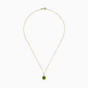 The 14K Yellow Gold Periodt and Diamond Pendant features a square-cut green gemstone and a vertical row of small white diamonds above it, creating an elegant and stylish necklace.