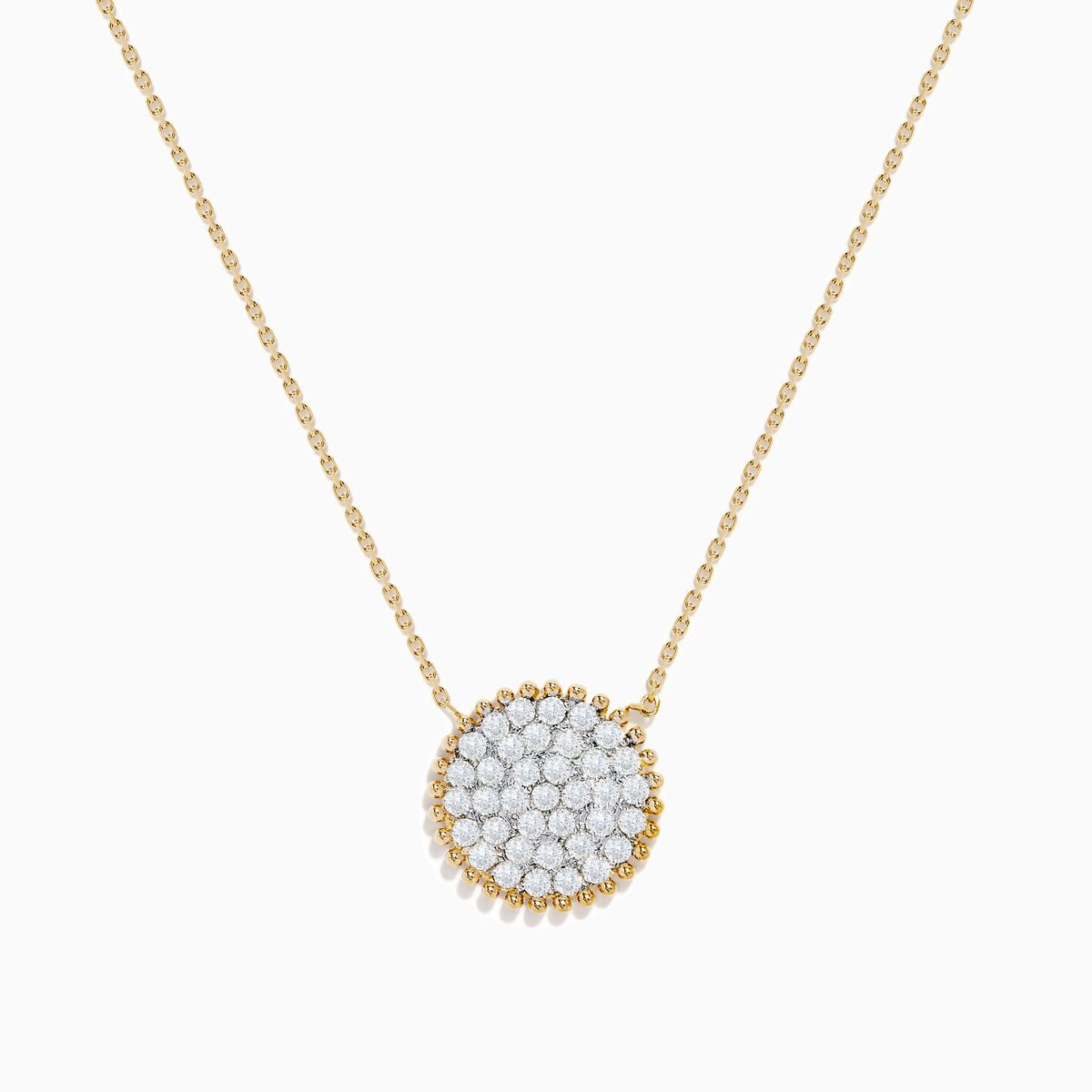 Elegant and minimalistic, the DOro 14K Yellow Gold Diamond Cluster Disc Necklace features a thin chain and a round pendant with sparkling diamonds, bordered by a delicate gold beaded edge.
