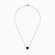 The Bordeaux 14K Yellow Gold Garnet and Diamond Heart Necklace features a heart-shaped red garnet pendant accented by two round diamonds on a delicate gold chain.
