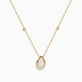 The Aurora 14K Yellow Gold Opal and Diamond Necklace showcases a teardrop opal pendant accented by two round diamonds, offering an elegant look with subtle diamond details.
